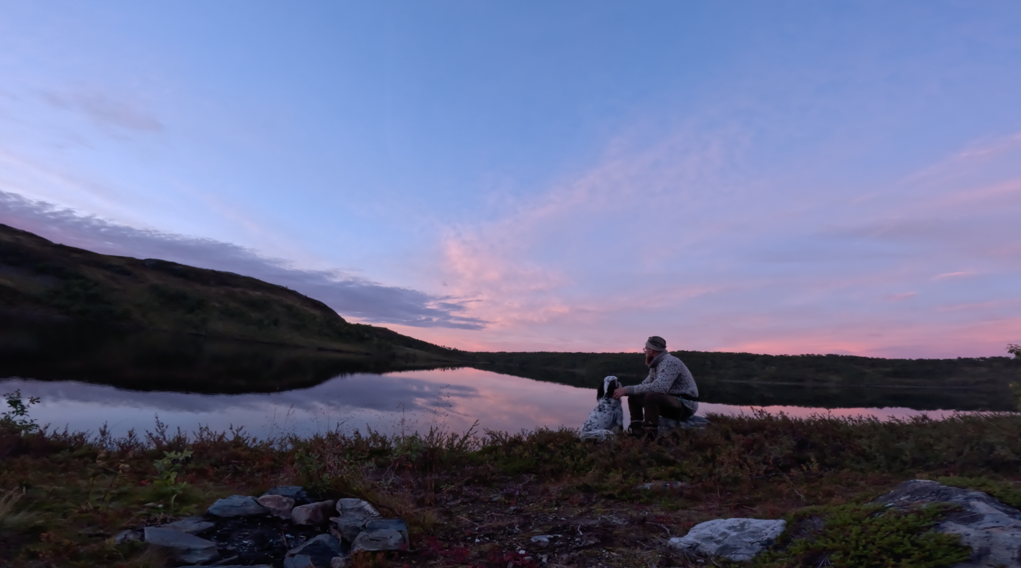Iver and his dog beside a mountain lake during the 10-day wilderness challenge